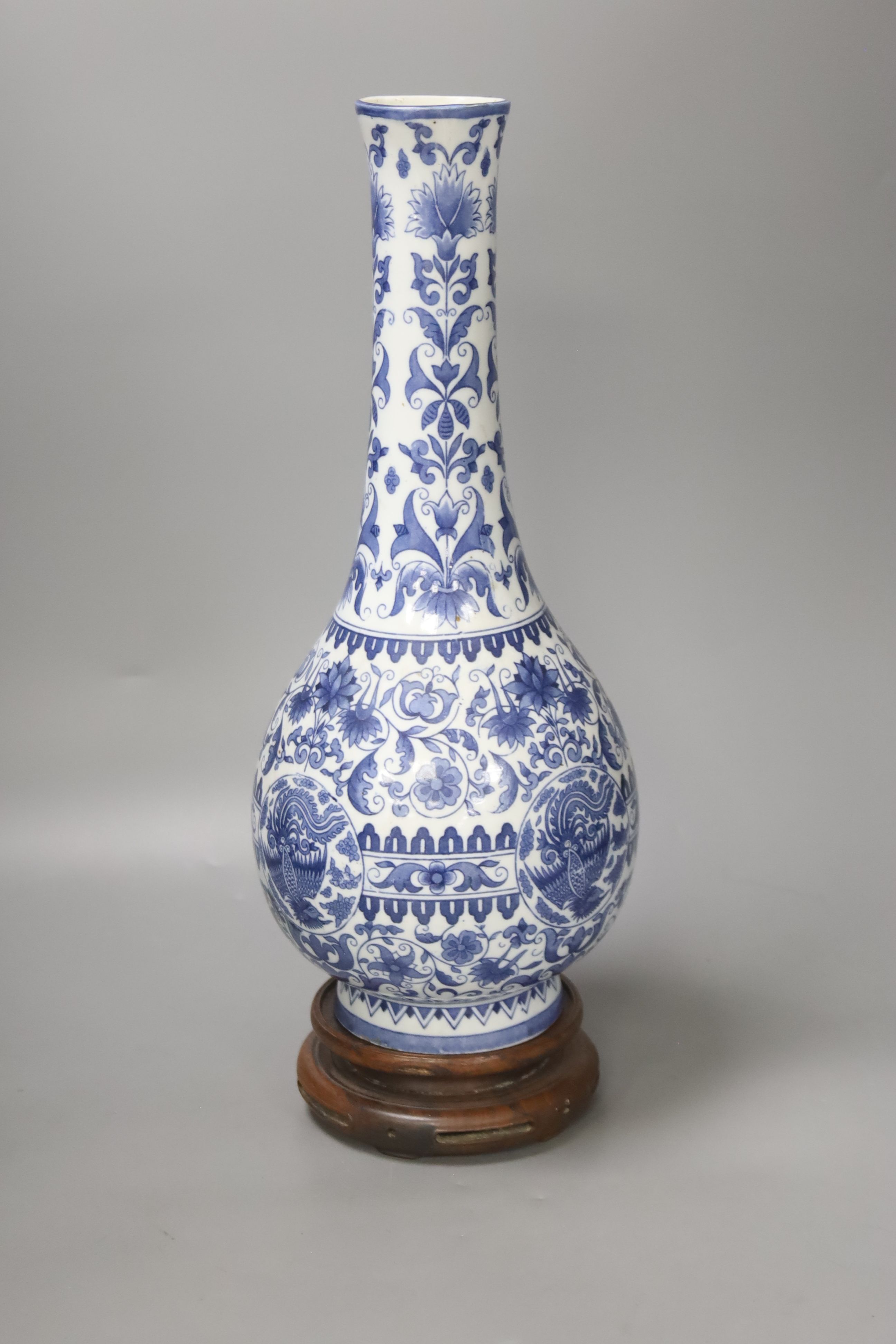 A Dutch porcelain blue and white long necked bottle vase